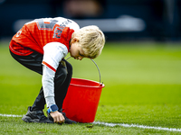 A young grass boy is present during the match between Feyenoord and Twente at the Feyenoord stadium De Kuip for the Dutch Eredivisie season...