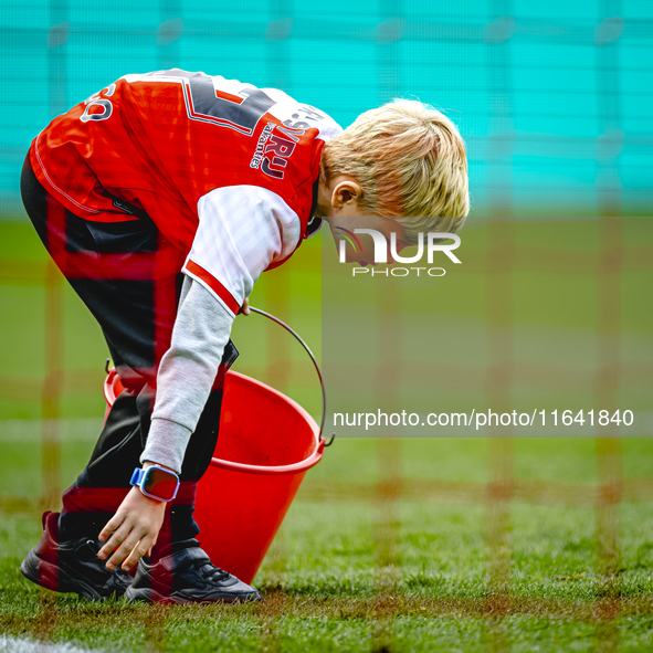 A young grass boy is present during the match between Feyenoord and Twente at the Feyenoord stadium De Kuip for the Dutch Eredivisie season...