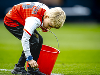 A young grass boy is present during the match between Feyenoord and Twente at the Feyenoord stadium De Kuip for the Dutch Eredivisie season...