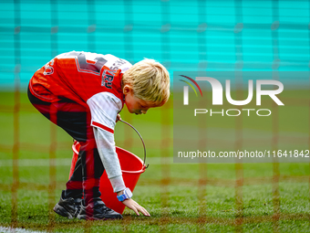 A young grass boy is present during the match between Feyenoord and Twente at the Feyenoord stadium De Kuip for the Dutch Eredivisie season...