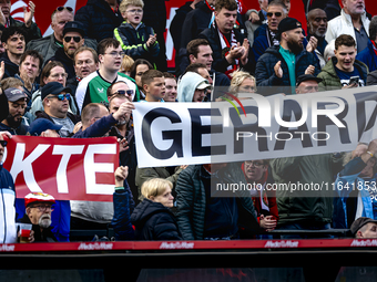 Supporters of Feyenoord Rotterdam attend the match between Feyenoord and Twente at the Feyenoord stadium De Kuip for the Dutch Eredivisie se...