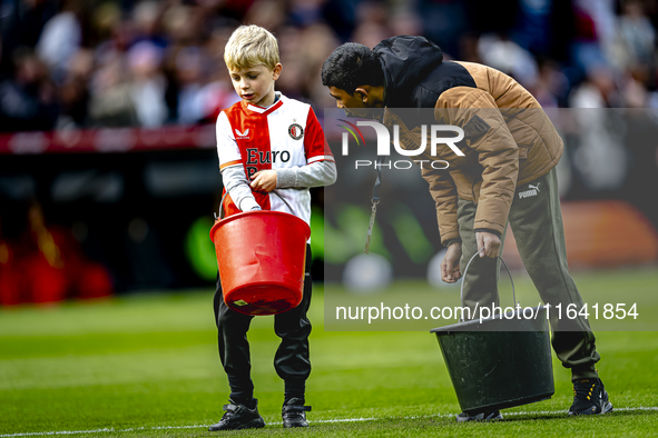 A young grass boy is present during the match between Feyenoord and Twente at the Feyenoord stadium De Kuip for the Dutch Eredivisie season...