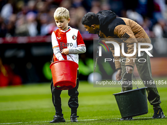 A young grass boy is present during the match between Feyenoord and Twente at the Feyenoord stadium De Kuip for the Dutch Eredivisie season...