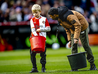 A young grass boy is present during the match between Feyenoord and Twente at the Feyenoord stadium De Kuip for the Dutch Eredivisie season...