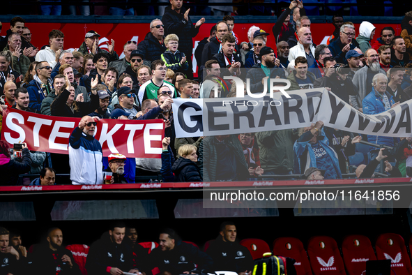 Supporters of Feyenoord Rotterdam attend the match between Feyenoord and Twente at the Feyenoord stadium De Kuip for the Dutch Eredivisie se...