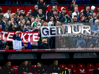 Supporters of Feyenoord Rotterdam attend the match between Feyenoord and Twente at the Feyenoord stadium De Kuip for the Dutch Eredivisie se...