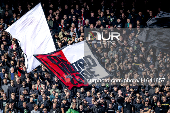 Supporters of Feyenoord Rotterdam attend the match between Feyenoord and Twente at the Feyenoord stadium De Kuip for the Dutch Eredivisie se...