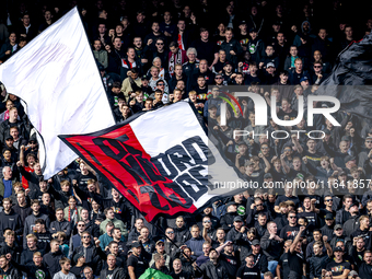 Supporters of Feyenoord Rotterdam attend the match between Feyenoord and Twente at the Feyenoord stadium De Kuip for the Dutch Eredivisie se...