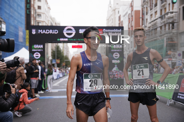 Toshikazu Yamanishi (left) and Francesco Fortunato (right) participate in the international 10km race walk in Madrid, Spain, on October 6. 