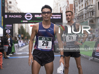 Toshikazu Yamanishi (left) and Francesco Fortunato (right) participate in the international 10km race walk in Madrid, Spain, on October 6. (