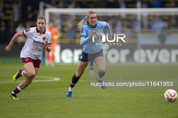 Jill Roord #10 of Manchester City W.F.C. is challenged by the opponent during the Barclays FA Women's Super League match between Manchester...