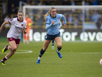 Jill Roord #10 of Manchester City W.F.C. is challenged by the opponent during the Barclays FA Women's Super League match between Manchester...