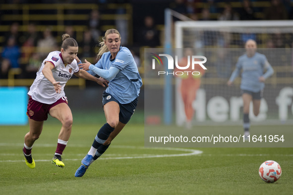 Jill Roord #10 of Manchester City W.F.C. is challenged by the opponent during the Barclays FA Women's Super League match between Manchester...