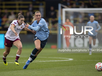 Jill Roord #10 of Manchester City W.F.C. is challenged by the opponent during the Barclays FA Women's Super League match between Manchester...