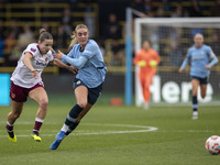 Jill Roord #10 of Manchester City W.F.C. is challenged by the opponent during the Barclays FA Women's Super League match between Manchester...