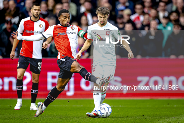 Feyenoord Rotterdam midfielder Quinten Timber and FC Twente midfielder Youri Regeer play during the match between Feyenoord and Twente at th...