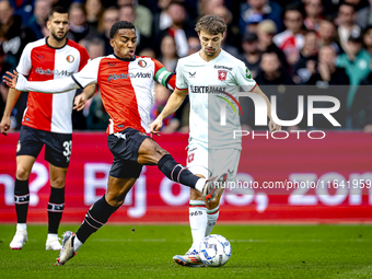 Feyenoord Rotterdam midfielder Quinten Timber and FC Twente midfielder Youri Regeer play during the match between Feyenoord and Twente at th...