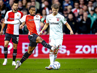 Feyenoord Rotterdam midfielder Quinten Timber and FC Twente midfielder Youri Regeer play during the match between Feyenoord and Twente at th...