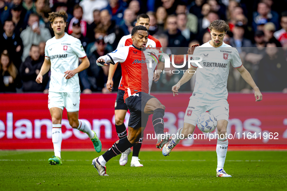 Feyenoord Rotterdam midfielder Quinten Timber and FC Twente midfielder Youri Regeer play during the match between Feyenoord and Twente at th...