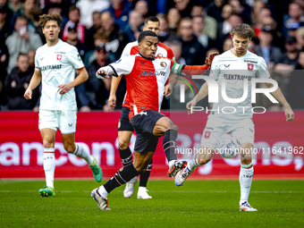 Feyenoord Rotterdam midfielder Quinten Timber and FC Twente midfielder Youri Regeer play during the match between Feyenoord and Twente at th...