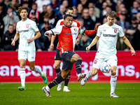 Feyenoord Rotterdam midfielder Quinten Timber and FC Twente midfielder Youri Regeer play during the match between Feyenoord and Twente at th...