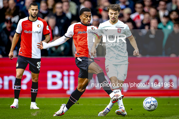 Feyenoord Rotterdam midfielder Quinten Timber and FC Twente midfielder Youri Regeer play during the match between Feyenoord and Twente at th...