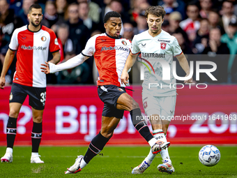 Feyenoord Rotterdam midfielder Quinten Timber and FC Twente midfielder Youri Regeer play during the match between Feyenoord and Twente at th...