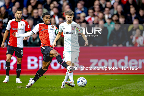 Feyenoord Rotterdam midfielder Quinten Timber and FC Twente midfielder Youri Regeer play during the match between Feyenoord and Twente at th...