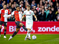 Feyenoord Rotterdam midfielder Quinten Timber and FC Twente midfielder Youri Regeer play during the match between Feyenoord and Twente at th...