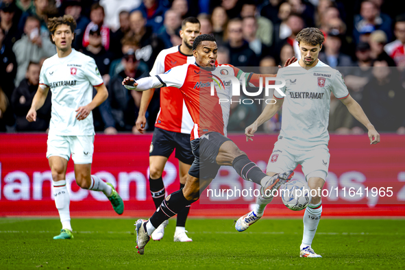 Feyenoord Rotterdam midfielder Quinten Timber and FC Twente midfielder Youri Regeer play during the match between Feyenoord and Twente at th...