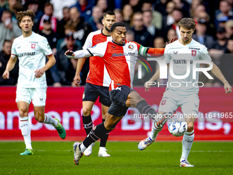 Feyenoord Rotterdam midfielder Quinten Timber and FC Twente midfielder Youri Regeer play during the match between Feyenoord and Twente at th...