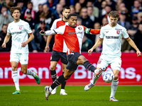 Feyenoord Rotterdam midfielder Quinten Timber and FC Twente midfielder Youri Regeer play during the match between Feyenoord and Twente at th...