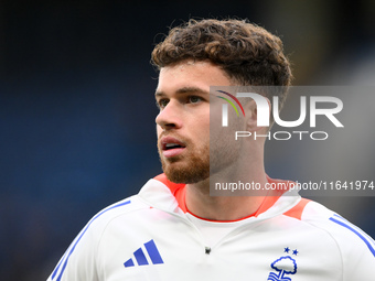 Neco Williams of Nottingham Forest warms up ahead of kick-off during the Premier League match between Chelsea and Nottingham Forest at Stamf...