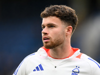 Neco Williams of Nottingham Forest warms up ahead of kick-off during the Premier League match between Chelsea and Nottingham Forest at Stamf...