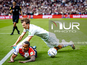 Feyenoord Rotterdam forward Igor Paixao and FC Twente midfielder Youri Regeer play during the match between Feyenoord and Twente at the Feye...