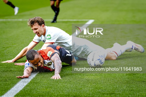 Feyenoord Rotterdam forward Igor Paixao and FC Twente midfielder Youri Regeer play during the match between Feyenoord and Twente at the Feye...