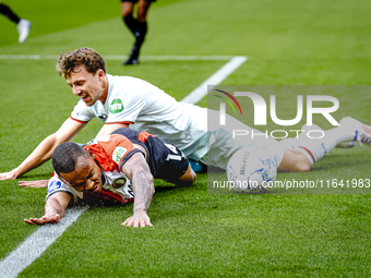 Feyenoord Rotterdam forward Igor Paixao and FC Twente midfielder Youri Regeer play during the match between Feyenoord and Twente at the Feye...