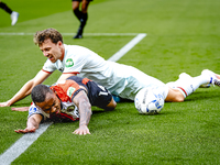 Feyenoord Rotterdam forward Igor Paixao and FC Twente midfielder Youri Regeer play during the match between Feyenoord and Twente at the Feye...