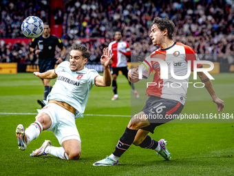 FC Twente defender Bart van Rooij and Feyenoord Rotterdam defender Hugo Bueno play during the match between Feyenoord and Twente at the Feye...