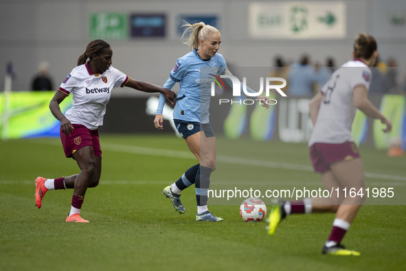 Alex Greenwood #5 of Manchester City W.F.C. is challenged by the opponents during the Barclays FA Women's Super League match between Manches...