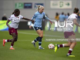 Alex Greenwood #5 of Manchester City W.F.C. is challenged by the opponents during the Barclays FA Women's Super League match between Manches...