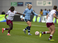 Alex Greenwood #5 of Manchester City W.F.C. is challenged by the opponents during the Barclays FA Women's Super League match between Manches...