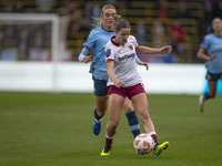 Anouk Denton #18 of West Ham United F.C. is challenged by Jill Roord #10 of Manchester City W.F.C. during the Barclays FA Women's Super Leag...