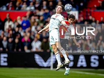 FC Twente forward Daan Rots and Feyenoord Rotterdam defender Hugo Bueno play during the match between Feyenoord and Twente at the Feyenoord...