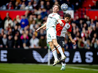 FC Twente forward Daan Rots and Feyenoord Rotterdam defender Hugo Bueno play during the match between Feyenoord and Twente at the Feyenoord...