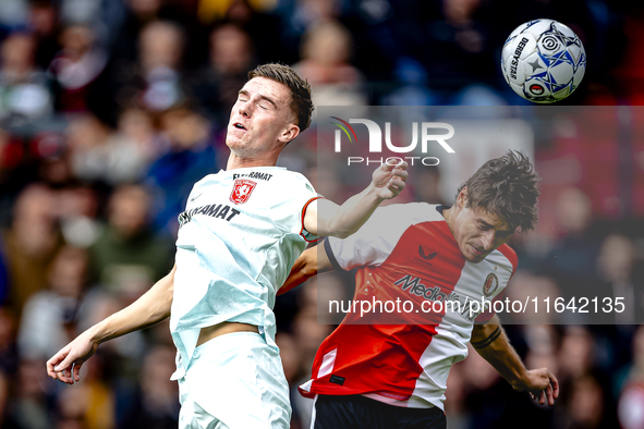 FC Twente forward Daan Rots and Feyenoord Rotterdam defender Hugo Bueno play during the match between Feyenoord and Twente at the Feyenoord...