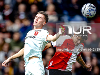 FC Twente forward Daan Rots and Feyenoord Rotterdam defender Hugo Bueno play during the match between Feyenoord and Twente at the Feyenoord...