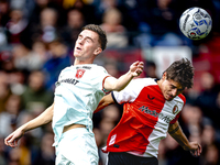 FC Twente forward Daan Rots and Feyenoord Rotterdam defender Hugo Bueno play during the match between Feyenoord and Twente at the Feyenoord...