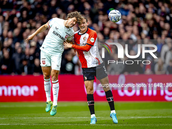 FC Twente forward Sam Lammers and Feyenoord Rotterdam defender Thomas Beelen play during the match between Feyenoord and Twente at the Feyen...