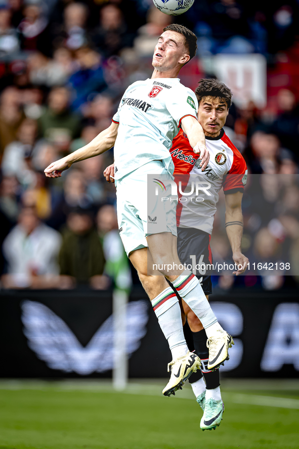 FC Twente forward Daan Rots and Feyenoord Rotterdam defender Hugo Bueno play during the match between Feyenoord and Twente at the Feyenoord...